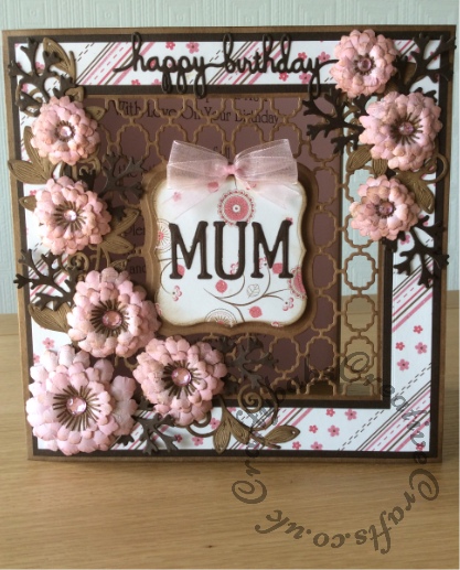 Birthday card for mum made using mostly Spellbinders dies including; Spellbinders 6x6 card creator labels 1, Spellbinders shapeabilities flower bundle, Spellbinders Majestic morning blooms, Spellbinders foliage, Spellbinders Julius Alphabet dies, D-lites sentiments 3, Labels One nesting dies and Cheery Lynn build a flower 1 for flower centres. Die cuts embossed with ball shaping tool and inked with Tim Holtz Walnut stain distress ink. Flat back gems used for flower centres adhered with glossy accents - craftybabscreativecrafts.co.uk