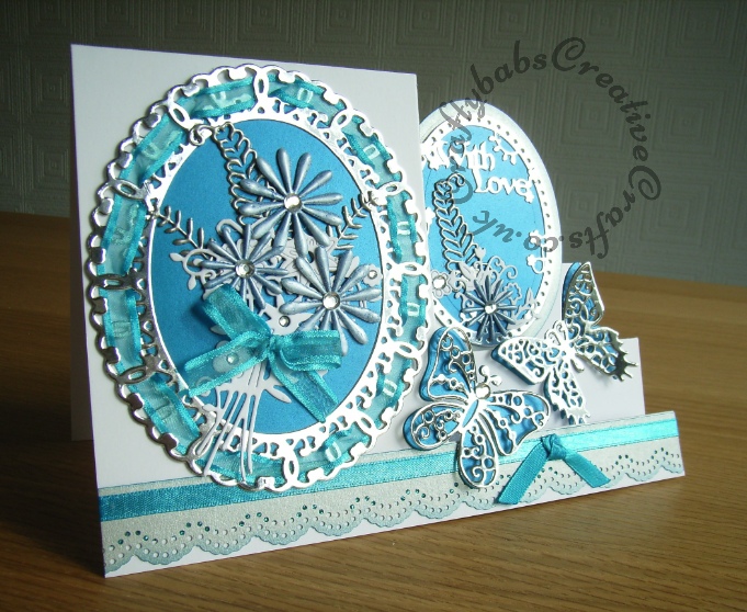 Stepper Card made using Tattered Lace Interlocking with love oval die, Tattered Lace Venetian floral dies, Spellbinders Papillon dies. Border done with tonic doily punch - craftybabscreativecrafts.co.uk