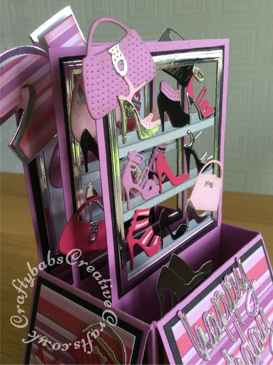 Shoes and Handbags Pop Up 21st Card made using a variety of dies including; Robert Addams small shoes & boots and small handbags dies. Sizzix Originals Shadow Box numbers dies, Sizzix thinlits Tim Holtz celebration script sentiment dies (paper-pieced to make other words), Tattered Lace essential nesting rectangles dies, Memory box pretty pumps and platform pumps dies - craftybabscreativecrafts.co.uk