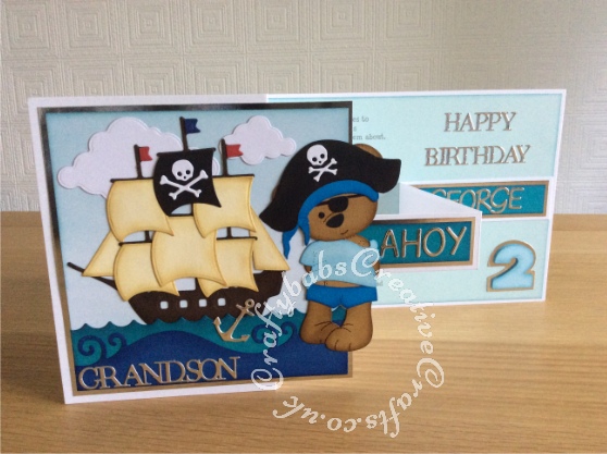 Pirate double Z fold birthday cards made for twins having a pirate themed birthday party. Made using a variety of dies including Custom made wooden Tattoo bear die, Go Kreate Boo Bear Pirate outfit, summertime outfit and dress dies, Xcut build a scene nautical dies, Tattered Lace sentiment dies, Apple Blossom capitals alphabet die and Sizzix originals shadow box numbers dies - craftybabscreativecrafts.co.uk