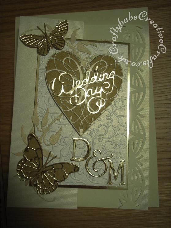 Monogrammed Wedding card made using various dies including; Memory Box Grand heart dies, Memory Box La Rue heart die, Memory B Darl & Vivienne butterfly dies, memory Box Kaleidoscope and Moonlight butterfly dies, Marianne creatables flower stem & leaf die, Sizzix sizzlits wedding day sentiment die and Spellbinders Julius alphabet dies. - craftybabscreativecrafts.co.uk