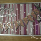 Fizzy Moon Decoupage banner Christmas card made using Fizzy moon decoupage pad, Britannia dies Happy Christmas sentiment dies and Memory Box Alphabet Soup upper case dies- craftybabscreativecrafts.co.uk