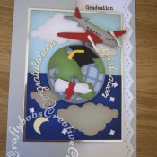 Kinetic Graduation Card made using; Xcut Build a scene All aboard round the world dies, Birtannia dies congratulations sentiment, custom made graduation teddy die for mortar board and scroll. Martha Stewart edge punch zig zag used for insert. - craftybabscreativecrafts.co.uk