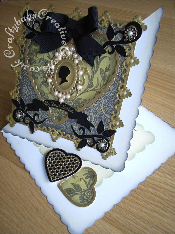 Large Vintage Twisted Easel Birthday card made using various dies including; Cheery Lynn Heart lace doily dies, Spellbinders antiques frames and accents border die, Marianne dies Eline's baby silhouette and frame die set, Leanne Creatief curved square frame die set for flourishes and Leanne Creatief swirl circle and flowers die set for small flowers and leaves. - craftybabscreativecrafts.co.uk