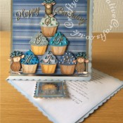 8"x8" House-Mouse Cup Cake Easel Card made using Stamped and coloured House-Mouse images, and Quickutz Revolution Cupcake die, Britannia Happy Birthday Sentiment die, Cheery Lynn Delicate Lace Script Alphabet dies, Quickutz nesting scalloped square dies and Cuttlebug 2x2 embossing folder. - craftybabscreativecrafts.co.uk