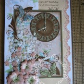 A4 Floral time themed 80th Birthday card made using a variety of dies including; Memory Box Gwyneth flourish die, Memory Box Kaleidoscope and Moonlight butterfly dies, Marianne Craftables Clock CR1234 dies, Cheery lynn Build a flower #1 set for stamens and Quickutz Wildflower die set for large flowers and floral sprays. - craftybabscreativecrafts.co.uk