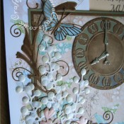 A4 Floral time themed 80th Birthday card made using a variety of dies including; Memory Box Gwyneth flourish die, Memory Box Kaleidoscope and Moonlight butterfly dies, Marianne Craftables Clock CR1234 dies, Cheery lynn Build a flower #1 set for stamens and Quickutz Wildflower die set for large flowers and floral sprays. - craftybabscreativecrafts.co.uk