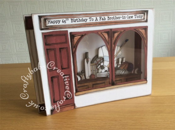 A4 sized 3 Dimensional Sports Shop Card made using the Katy Sue Designs Fabulous Fellas CD rom. Templates enlarged to create larger format card. Images inside decoupaged for dimension and acetate placed behind window frames. - craftybabscreativecrafts.co.uk