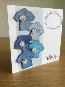 Male birthday card made using Clearly Besotted 'Super Dad' stamp set to stamp shirts which were then fussy cut. Letters stamped using Docrafts Papermania Madame Payraud's Typewriter upper case alphabet urban stamps. Background masked and inked with distress ink. - craftybabscreativecrafts.co.uk