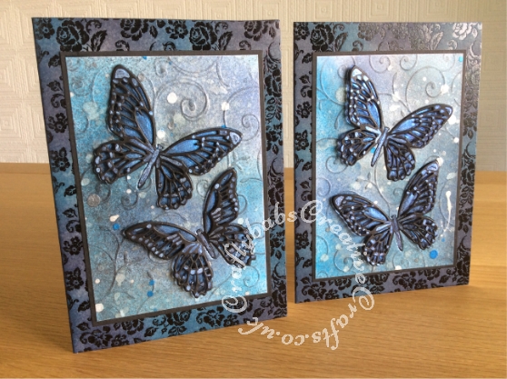 Inky Butterfly cards made using Xcut A4 delicate flourishes embossing folder and Sizzix Tim Holtz Detailed Butterflies thinlits dies. Card bases are pre printed forever friends card blanks that have been inked to co-ordinate. Background distress inked, sprayed and splattered with various pearlescent inks and Spectrum Noir Sparkle pen (clear). - craftybabscreativecrafts.co.uk