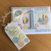 1st Birthday Card and matching gift tag made using the following dies; Sizzix Bigz Sassy Serif Numbers, Crealies Nest-Lies Double stitch circles No 33, set of 4 Cuttlebug 2x2 Zoo animals dies, sentiment from various Tattered Lace 3 Die-mensions die sets and Britannia dies Grand son sentiment dies used on tag. - craftybabscreativecrafts.co.uk