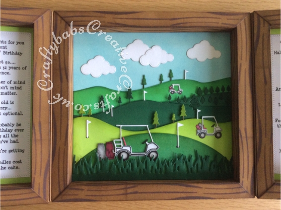 Golf themed Shadow Box Window Card made using a number of dies including; Tonic shadow Box Creations Die set 1635E, Tattered Lace sentiments dies, Lea'bilities Golf Bag & Clubs dies, Spellbinders golf die for flag and gold ball, Memory Box Dies, Mini Golf Carts, Memory Box Golf cart, Memory Box Golf landscape die, Clouds from Xcut Build a scene All aboard die set, Grass border from Xcut English Countryside Borders die set and Tattered Lace Panorama Trees (D634), The base card is plain brown which I have inked with distress inks in various shades of brown through a wood grain effect stencil. - craftybabscreativecrafts.co.uk