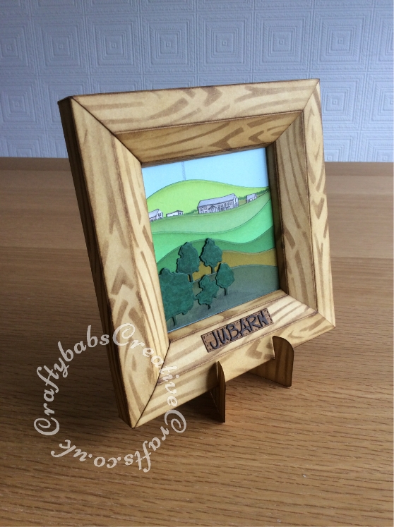 3D Picture New home card made using a pre-bought 3d card frame from Tonic and various dies including Xcut English Countryside Borders die set, MFT Die-namics Snow Drifts MFT-232, House name plaque made using Marianne Designs Dies - Wood Border die and Die-Versions MARKER MICRO Font Die - craftybabscreativecrafts.co.uk