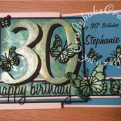 Double Z Fold 30th Birthday Card made using a variety of dies including; Memory Box Leavenworth & Cascadia Trio butterfly dies, Memory Box Darla & Vivienne Butterfly dies, 660223 Sizzix Thinlits Die Set 13PK - Celebration Words Script by Tim Holtz and 656617 Sizzix Bigz Sassy Serif Numbers. Background made using Distress oxide inks, Spectrum Noir sparkle pen and mica spray inks - craftybabscreativecrafts.co.uk