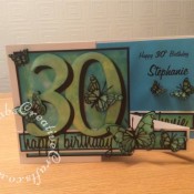 Double Z Fold 30th Birthday Card made using a variety of dies including; Memory Box Leavenworth & Cascadia Trio butterfly dies, Memory Box Darla & Vivienne Butterfly dies, 660223 Sizzix Thinlits Die Set 13PK - Celebration Words Script by Tim Holtz and 656617 Sizzix Bigz Sassy Serif Numbers. Background made using Distress oxide inks, Spectrum Noir sparkle pen and mica spray inks - craftybabscreativecrafts.co.uk