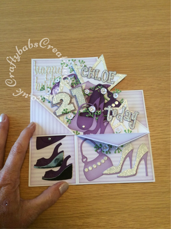 Large Pop Up Shoes & Bags themed 21st Birthday card made from 8"x8" card blank. Numerous dies used including; Sizzix Framelits Stars/ Primitive Die Set, Sizzix sizzlits 'Girls Are Weird' alphabet dies, Sizzix originals Shadow Box numbers, Sizzix sizzlits small purses and shoes set and shoes set, Ellison window cuts handbag, Cheery Lynn Baby's breath flower set, MCS sprig dies (from The Works) and Sentiment die cut using 660223 Sizzix Thinlits Die Set 13PK - Celebration Words Script by Tim Holtz - craftybabscreativecrafts.co.uk