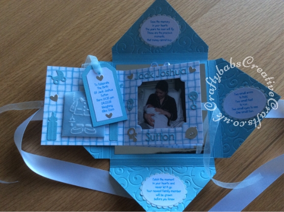 Baby Boy Birth keepsake made using a variety of dies including Quickutz nesting Tag dies, Ellison thick cutz envelope die, Cuttlebug baby elements die, Marianne baby feet dies, Memory Box pram die, nesting plain & scalloped oval dies, Memory box alphabet soup upper and lower case dies, Parchment pocket made using an envelope template stencil, baby clothes and baby words embossed using brass stencils, outer cover embossed using couture creations intrinsic embossing folder.- craftybabscreativecrafts.co.uk