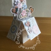 Pop up Wedding card made using a number of dies including; Spellbinders nesting plain and scalloped hearts dies, Cheery lynn flowers dies, Anna griffin flourish scroll die, spellbinders lacey circles dies, Crea Nestlies no 33 dies, leabilities frame square curve die set (for small flourishes). Joy cut & emboss wedding die set, Nellies nesting stitched squares dies, Background embossed with Hiclory Smoke distress ink applied to folder using embossaliscious a4 folder. die cuts inked with Hickory smoke distress inks, Flowers coloured with Spectrum noir sparkle pens. Tattered Lace sentiments 2014 dies and Tattered Lace Metal Die-Alpha Bunting dies for 'MEXICO'.- craftybabscreativecrafts.co.uk