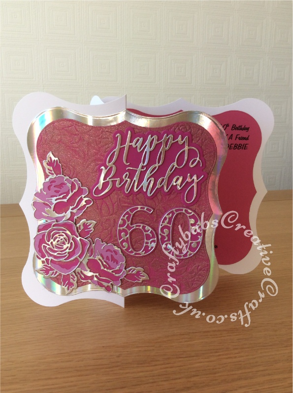 Large 8" x 8" 60th Birthday card made using shaped card blank, Jus-Cutz A4 nesting dies, Card Making Magic Die Set Solid Number & Suffix by Christina Griffiths, Card Making Magic Dies Overlay Number & Suffix Everyday Edition Filigree Pattern Christina Griffiths, Card Making Magic Die Set Happy Birthday Sentiment | 6in x 6in Collection by Christina Griffiths, Card making Magic Die Set Christmas Rose by Christina Griffiths, Alt-e-new Layered Rose die set, free with issue 174 of Simply Cards & Papercraft magazine, Tattered Lace embossing folder Floral (EF042), embellished with Cosmic Shimmer Pink Sapphire Glitter Kiss. - craftybabscreativecrafts.co.uk
