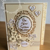 Golden Wedding Anniversary card made using a variety of dies including Tonic Studios Intrica Romantic Vine Die Set ovals, Spellbinders nesting plain & scalloped hearts, Memory box Norrland Flowers dies, Cheery Lynn baby's breath, Britannia alphabet dies, Tattered Lace Wedding Anniversary sentiments, Spellbinders romantic agenda heart and swirls decorative strip dies - craftybabscreativecrafts.co.uk