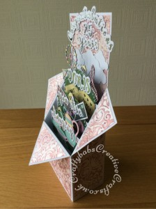 Pop up Box Congratulations card made using various dies including; Nellie's Multi Frames Dies Doily Flower MFD020, Crafters Companion Gemini Expressions Metal Die - Uppercase and lower case Alphabet and number Sets, scenic dies free gift from issue 39 of Die Cutting Essentials magazine, SIZZIX SIZZLITS TEATIME Set 654787, HELZ CUPPLEDITCH DIE - FUN FAIR - TICKET dies, cloud dies from various Xcut build a scene All Aboard die set. Mats and layers on base card embossed with Embossalicious A4 embossing folder, then pearl fininsh addes using Cosmic Shimmer gilding polish accented with Cosmic Shimmer Glitter Kiss. Bingo cards and numbers stamped and embossed using La Pashe flippin bingo stamp set. - craftybabscreativecrafts.co.uk