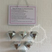 Hanging 60th Birthday plaque with suspended diamonds made using Sizzix Thinlits Plus Die Set DIAMOND BOX by Debbi Potter 661701 and Sizzix Originals Shadow Box alphabet dies. Diamonds supended from main plaque on invisible thread. - craftybabscreativecrafts.co.uk