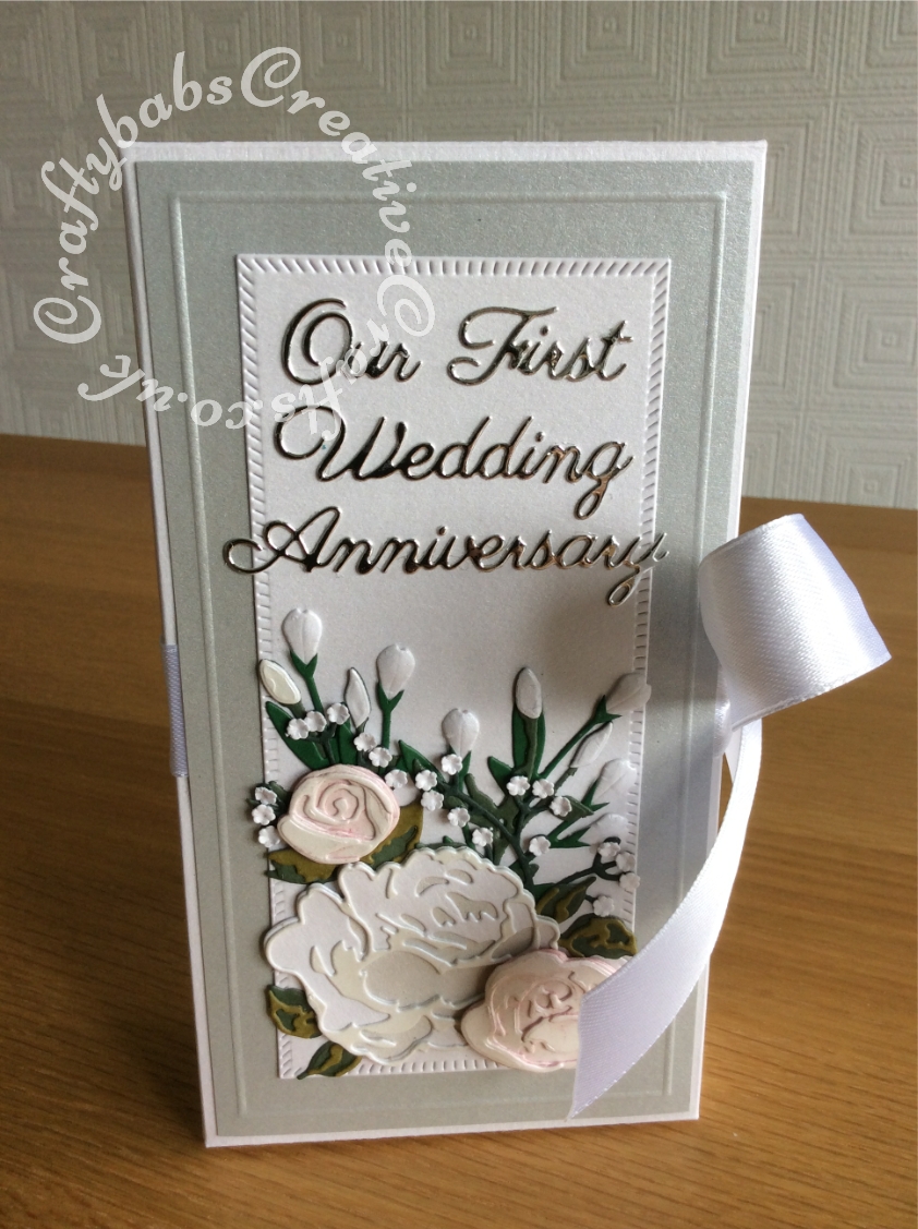 First Wedding Anniversary shadow box card replicating flowers in the bridal bouqet made using various dies including Tonic Shadow Box Creations die set, Heartfelt creations Majestic Blooms Die, Cheery Lynn Baby's breath flower die, Memory box Norrland flower dies, Altenew Garden Picks die set, Alt-e-new Layered Rose die set, free with issue 174 of Simply Cards & Papercraft magazine and Britannia Sentiment dies. - craftybabscreativecrafts.co.uk