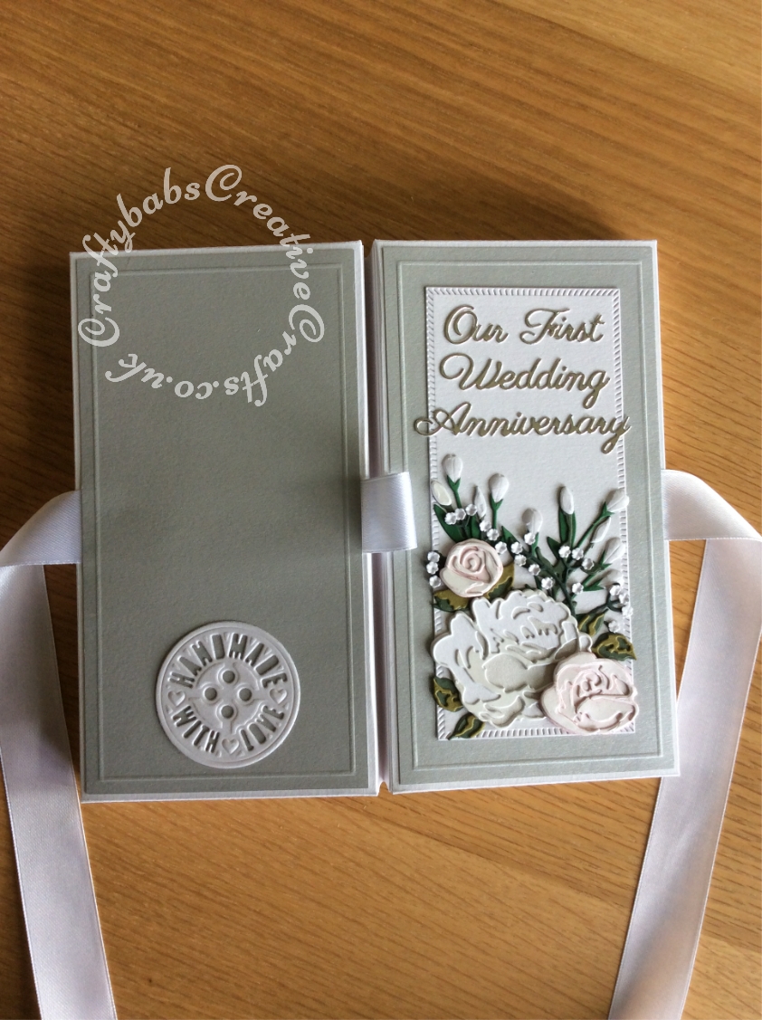 First Wedding Anniversary shadow box card replicating flowers in the bridal bouqet made using various dies including Tonic Shadow Box Creations die set, Heartfelt creations Majestic Blooms Die, Cheery Lynn Baby's breath flower die, Memory box Norrland flower dies, Altenew Garden Picks die set, Alt-e-new Layered Rose die set, free with issue 174 of Simply Cards & Papercraft magazine and Britannia Sentiment dies. - craftybabscreativecrafts.co.uk