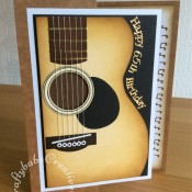 Guitar themed 65th birthday card made using hand cut guitar shape, nesting circles dies, body section of teddy bear die and sizzix label die. Tattered Lace sentiments 2014 dies. - craftybabscreativecrafts.co.uk