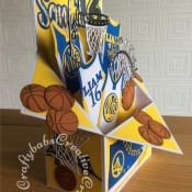 Large Basketball themed Pop Up Box Card made using various dies including; MFT All Star High Tops die set, Vintage Basketball Net (TLD0358), Sports Pack Metal Die set Cheery Lynn Dies B553, Championship die set (457861) – Tattered Lace, Sentiment from the Tattered Lace Zig Zag cascade card die set, Paper Boutique male relatives die and Sizzix originals Shadow Box Number dies. - craftybabscreativecrafts.co.uk