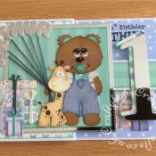 Ist birthday Boy Z Fold card made using various unbranded bear, bear outfit, giraffe and parcel dies, Alphabet balloons dies from The Works and Sizzix Bigz Sassy Serif Numbers dies - craftybabscreativecrafts.co.uk