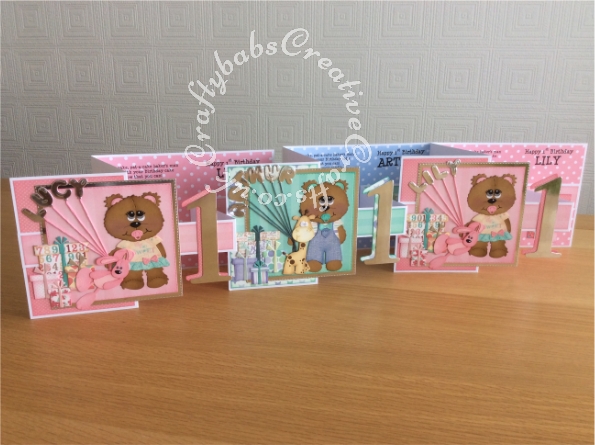 Ist birthday Triplets Z Folds card made using various unbranded bear, bear outfit, giraffe and parcel dies, Alphabet balloons dies from The Works and Sizzix Bigz Sassy Serif Numbers dies and Die Monde custom made wooden bear and bunny die. - craftybabscreativecrafts.co.uk