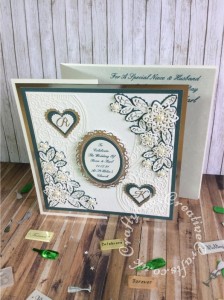 Large 8" square Wedding card made using a variety of dies including Tattered Lace double delights adore & Kaleidoscope flower corner dies, Spellbinders floral and plain nesting ovals & scalloped and plain nesting hearts. Sentiment printed, monograms die cut using Britannia Dies alphabet dies and layered onto hearts using spellbinders nesting plain and scalloped hearts dies. - craftybabscreativecrafts.co.uk