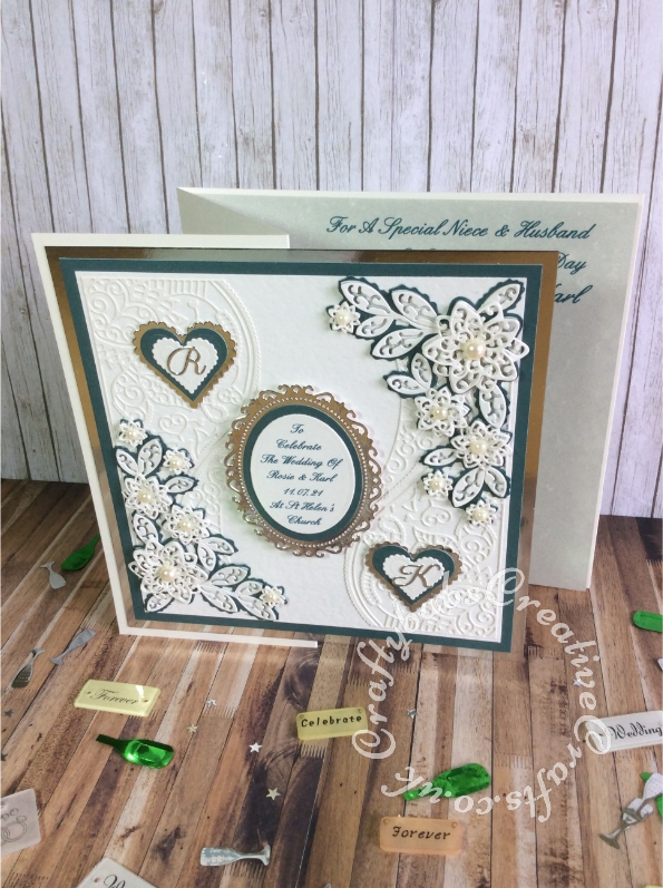 Large 8" square Wedding card made using a variety of dies including Tattered Lace double delights adore & Kaleidoscope flower corner dies, Spellbinders floral and plain nesting ovals & scalloped and plain nesting hearts. Sentiment printed, monograms die cut using Britannia Dies alphabet dies and layered onto hearts using spellbinders nesting plain and scalloped hearts dies. - craftybabscreativecrafts.co.uk
