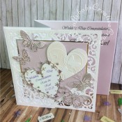 8″ square Wedding card made using included Spellbinders Gold Elements dies, Memory Box Kaleidoscope, moonlight, Pippi, Isabella, Vivienne and Darla butterflies, Bingham and Grand Heart dies. Background embossed with Darice embossing folder then heat embossed over iridescent mica powder. - craftybabscreativecrafts.co.uk