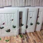 White on white layered Christmas cards made using various dies including: unbranded stitched rectangle dies, unbranded bare trees die, foliage dies and Mini Three Little Birds die by Tattered Lace. - craftybabscreativecrafts.co.uk