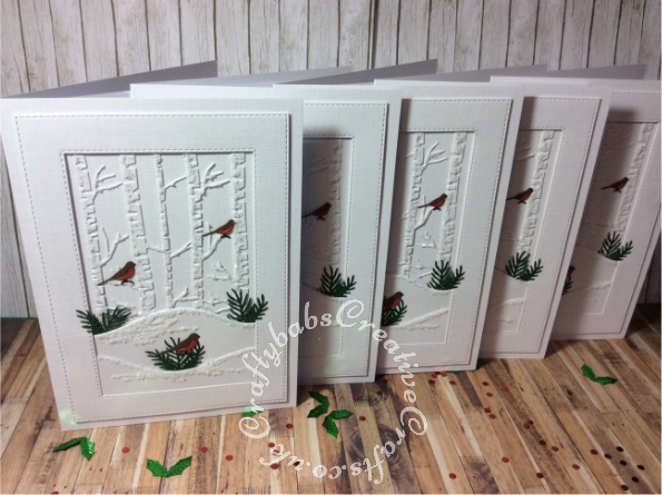 White on white layered Christmas cards made using various dies including: unbranded stitched rectangle dies, unbranded bare trees die, foliage dies and Mini Three Little Birds die by Tattered Lace. - craftybabscreativecrafts.co.uk
