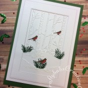 White on white layered Christmas card made using various dies including: unbranded stitched rectangle dies, unbranded bare trees die, foliage dies and Mini Three Little Birds die by Tattered Lace. - craftybabscreativecrafts.co.uk