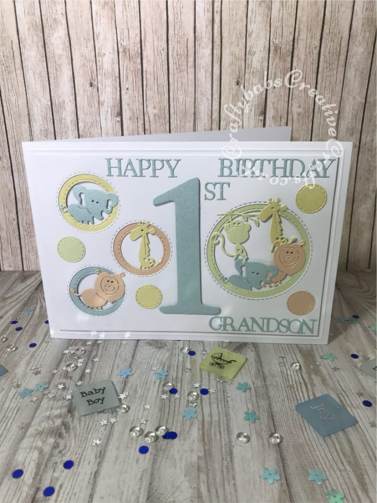 1st Birthday Card made using the following dies; Sizzix Bigz Sassy Serif Numbers, Crealies Nest-Lies Double stitch circles No 33, set of 4 Cuttlebug 2×2 Zoo animals dies, sentiment from various Tattered Lace 3 Die-mensions die sets. - craftybabscreativecrafts.co.uk