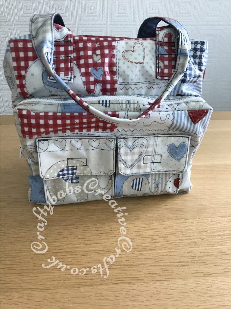 Baby changing bag made using Butterick Waverly B6148 sewing pattern. I adapted this by combining the large and small versions and joining them together. I made the changing mat to go inside by copying my daughters actual travel changing mat. - craftybabscreativecrafts.co.uk