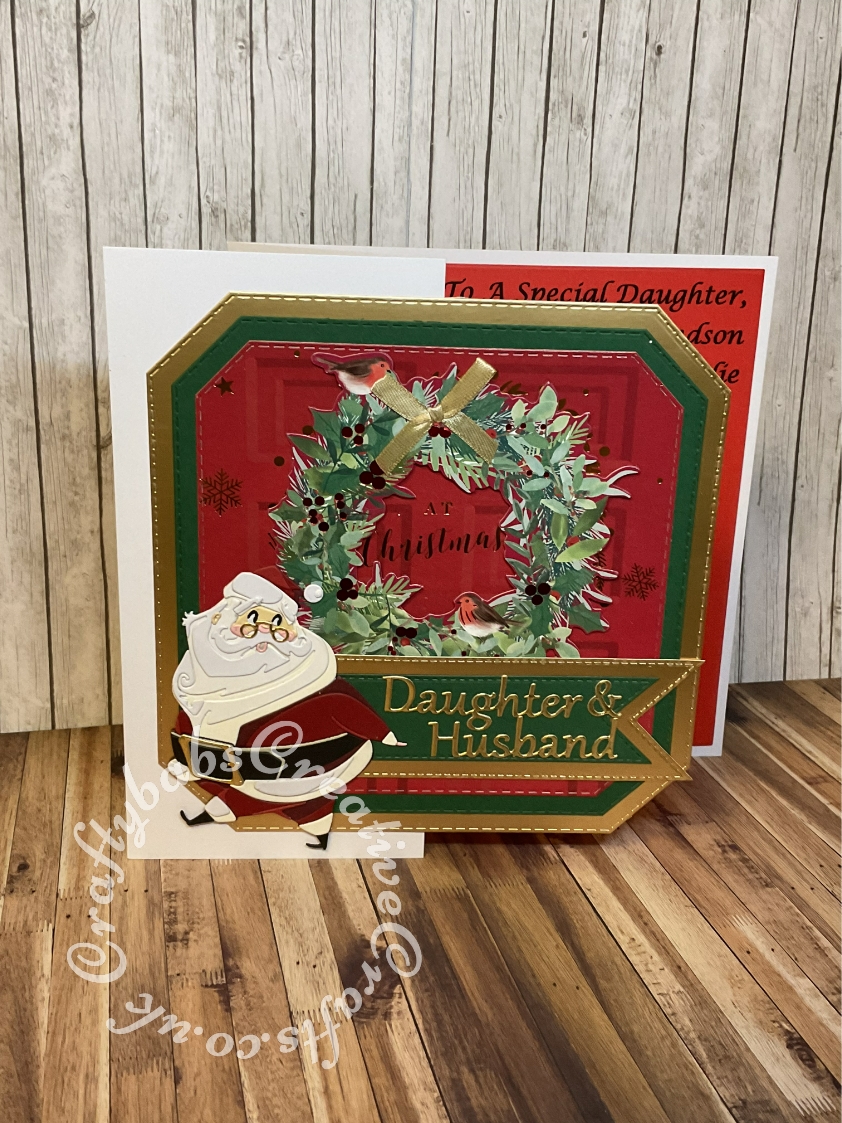 Large 8" Square Christmas card made using a recycled Christmas card for the background and toppers made using the following dies:- unbranded nesting stitched octagon dies, Sizzix - Tim Holtz - Christmas - Thinlits Dies - Jolly St. Nick, unbranded stitched tag dies and Card Making Magic relatives sentiment dies. - craftybabscreativecrafts.co.uk