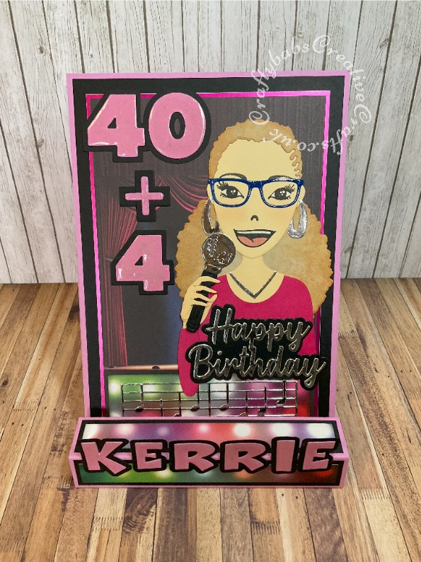 Karaoke themed Block Easel Card made using various dies including; Studio Light Missees Dies and stamps, unbranded sentiment and alphabet dies, Creative Craft Products Happy birthday sentiment dies, Memory Box music border die, Golf ball and tee from spellbinders Golf die for the microphone. Background from Kanban Topper and backing sheet. Lettering highlighted with Glossy accents. - craftybabscreativecrafts.co.uk