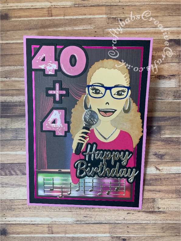 Karaoke themed Block Easel Card made using various dies including; Studio Light Missees Dies and stamps, unbranded sentiment and alphabet dies, Creative Craft Products Happy birthday sentiment dies, Memory Box music border die, Golf ball and tee from spellbinders Golf die for the microphone. Background from Kanban Topper and backing sheet. Lettering highlighted with Glossy accents. - craftybabscreativecrafts.co.uk